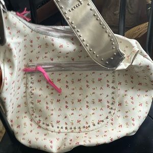 White Crossbody bag with silver sling “LOVE”. and pink rose buds on purse.